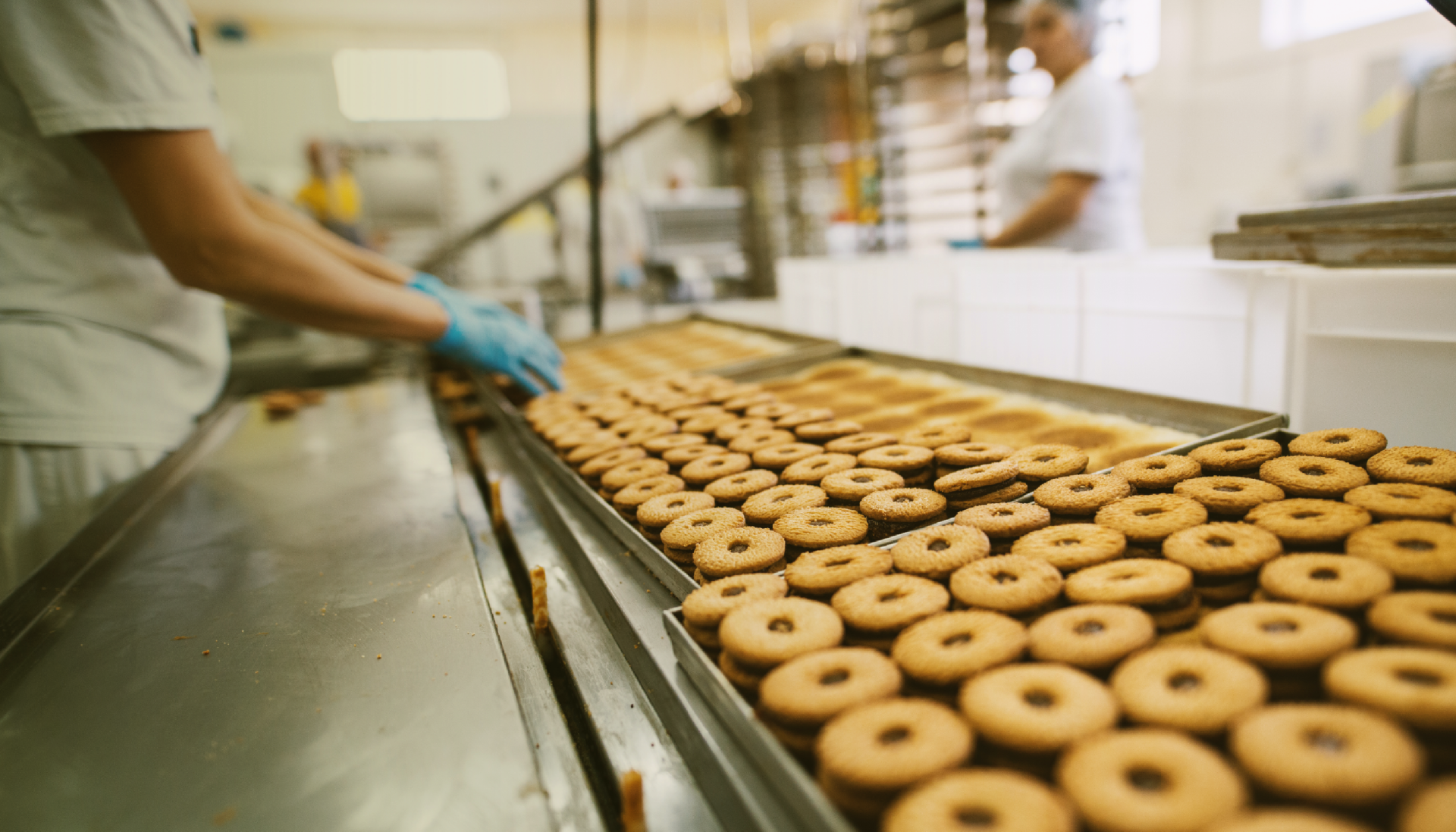 Conveyor belt in a cookie factory, showcasing agile manufacturing and Industry 4.0 principles, driving digital transformation in the manufacturing industry.